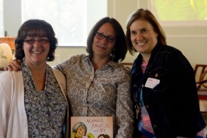 TLC Prep teachers Janet Armstrong and Becky Durichek stand on either side of author Meg Medina. 