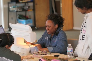 Renea Smallwood demonstrates a quarter-inch seam in a sewing class she held at the church.