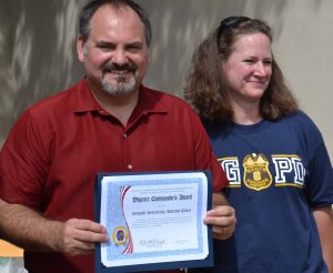 Major Kara Lloyd presented Beltsville Adventist Church Pastor Tim Madding with the District Commanders Award as recognition for leading the church in creating a courtyard for the officers in Beltsville’s Precinct 6 station.